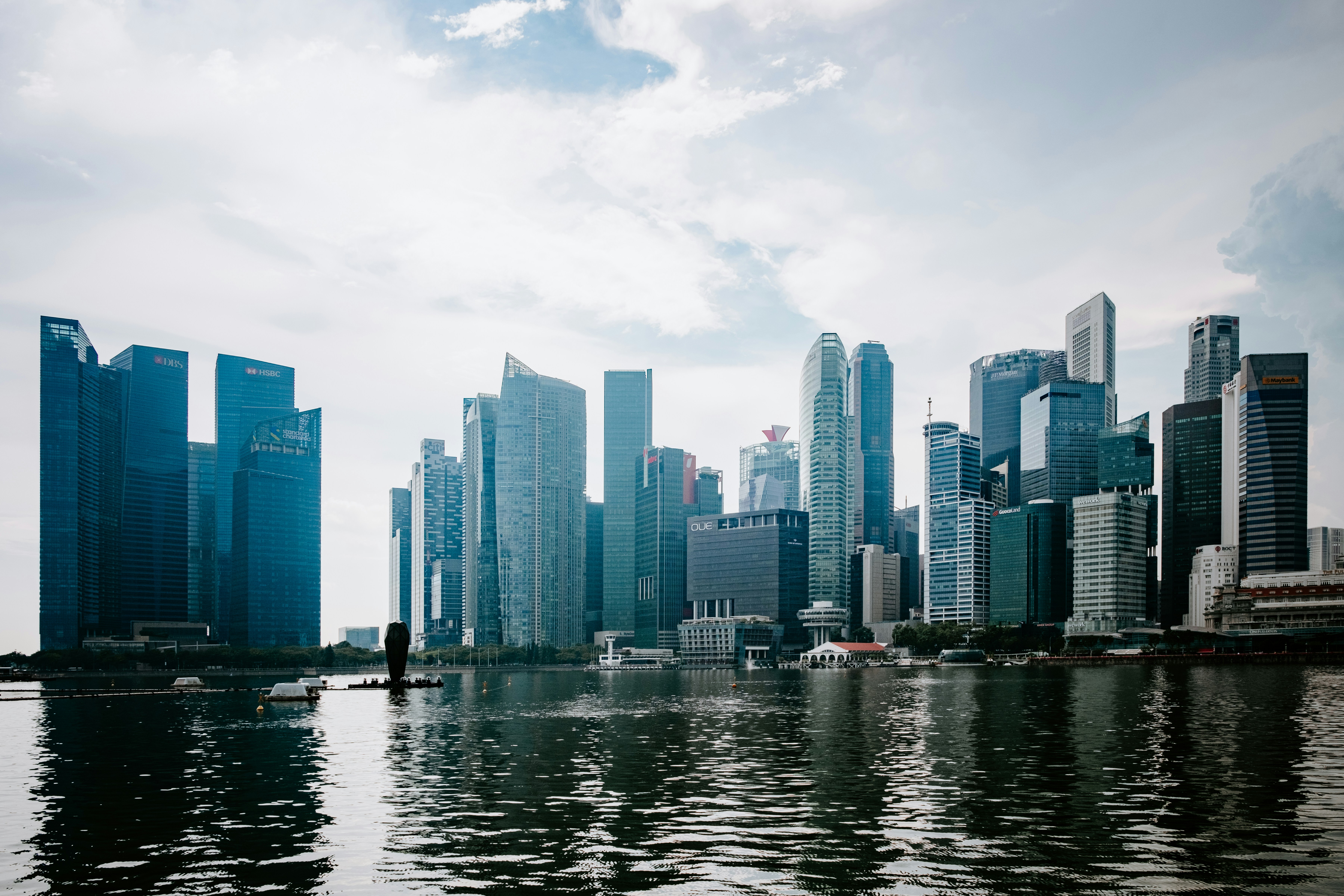 a large body of water with a city in the background