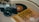 An analog camera, a vinyl record, and a book titled 'The Subtle Art of Not Giving a F*ck' are placed on a flat surface, suggesting a blend of photography, music, and literature.