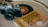 An analog camera, a vinyl record, and a book titled 'The Subtle Art of Not Giving a F*ck' are placed on a flat surface, suggesting a blend of photography, music, and literature.