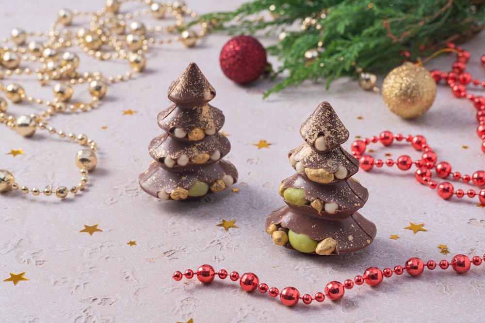 a group of small christmas trees sitting on top of a table