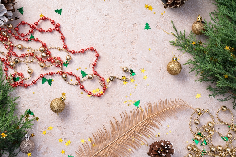 a table topped with christmas decorations and pine cones