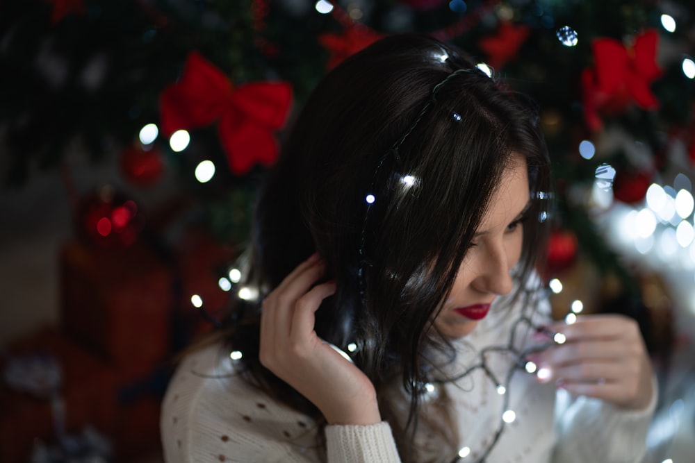 a woman holding a cell phone to her ear