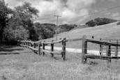 A photo of a completed fencing project in a rural setting.