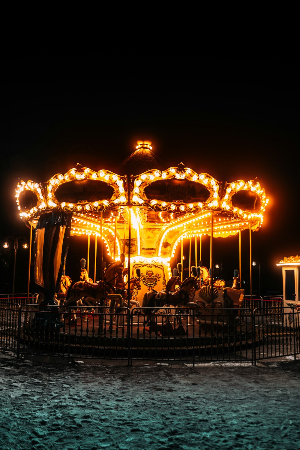 a merry go round at night with people on it