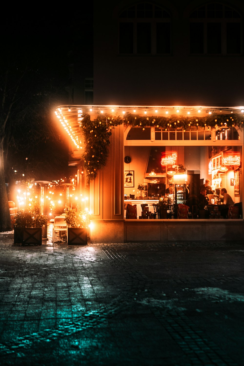 a store front with lights on it at night