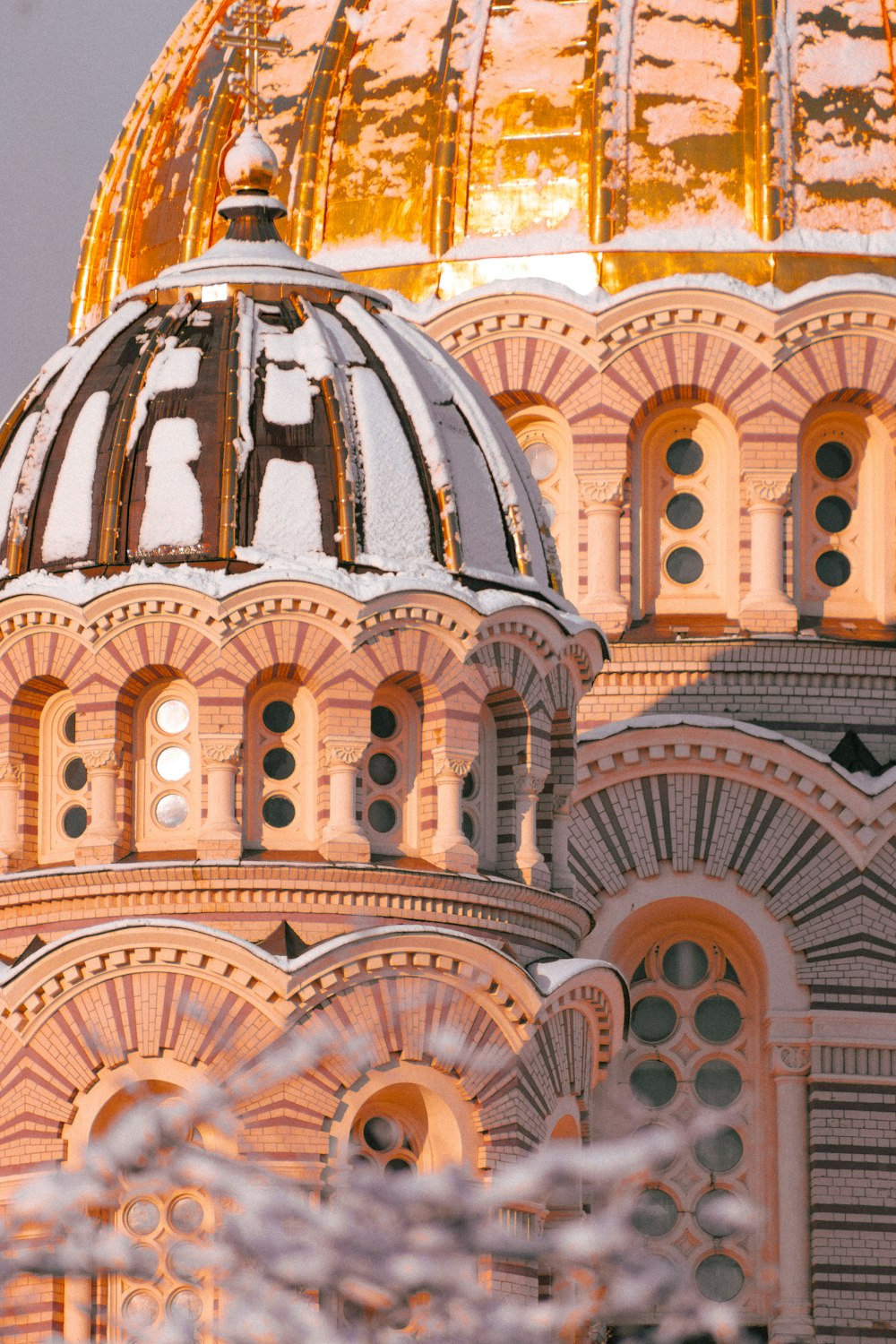 a close up of a building with a gold dome