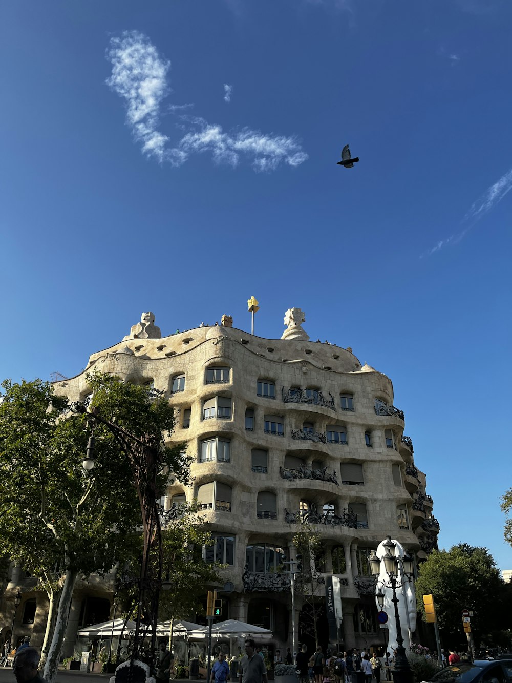 a large building with a bird flying over it