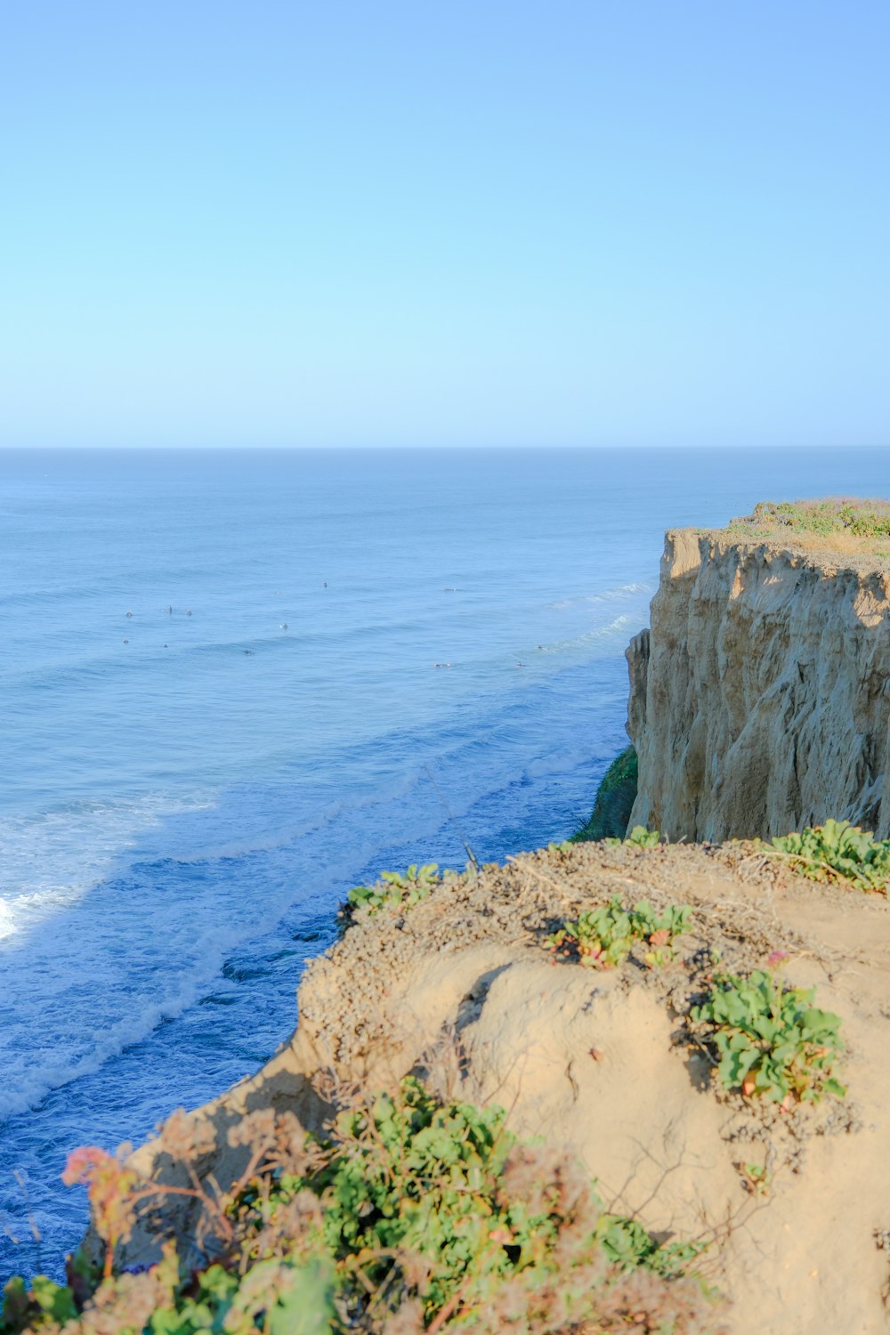 a view of the ocean from a cliff