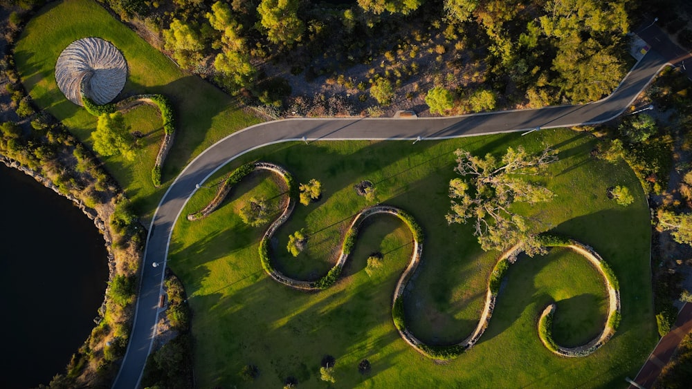 an aerial view of a winding road in a park