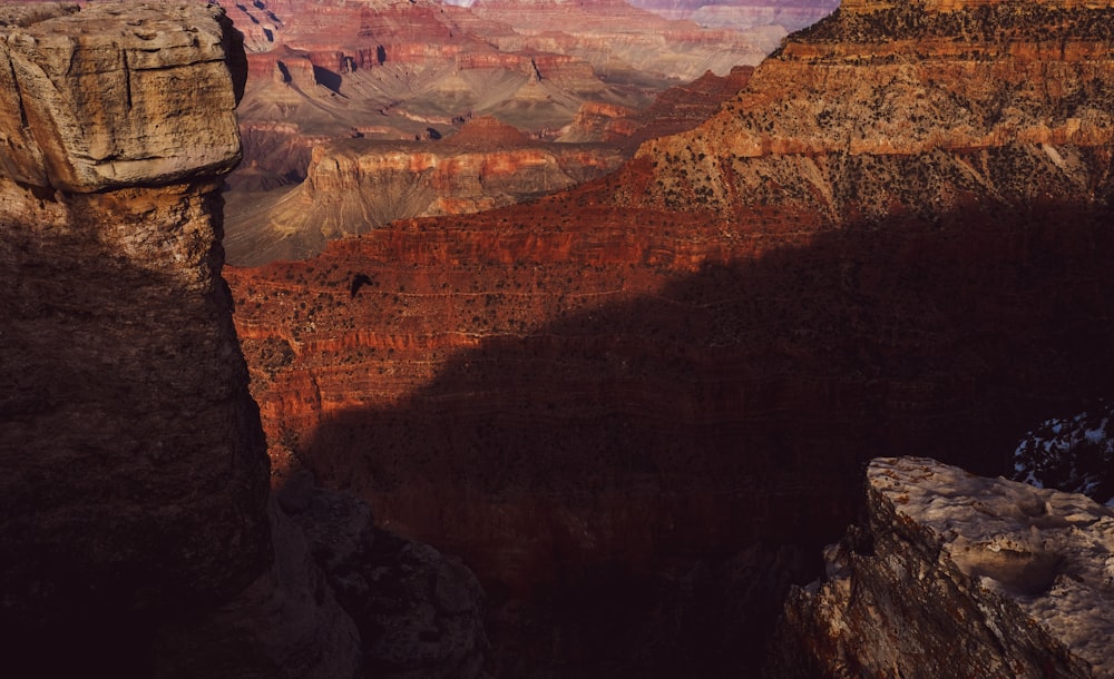 a view of the grand canyon from the edge of a cliff