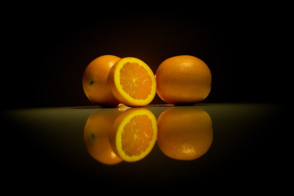 a group of oranges sitting on top of a table