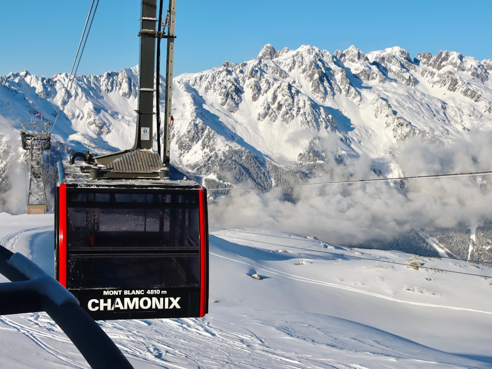 a ski lift going up a snowy mountain