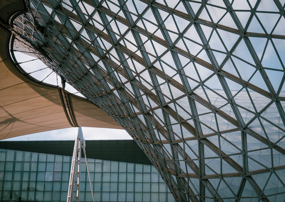 a large metal structure with a clock on it's side