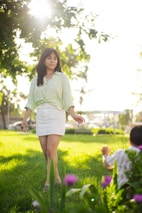 A joyful woman walking briskly in a park, showing active lifestyle and confidence.