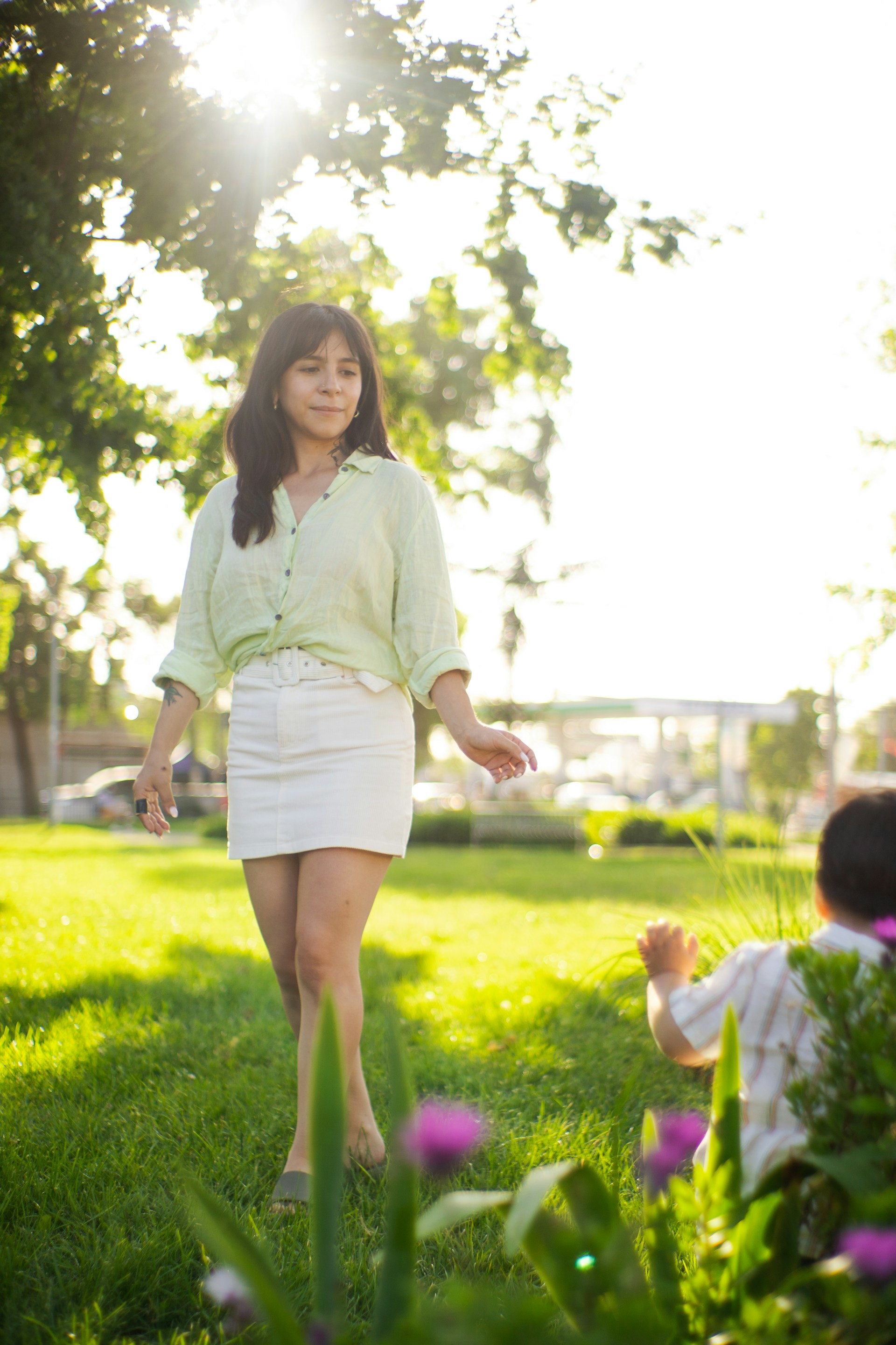 woman wearing yellow long-sleeved dress under white clouds and blue sky during daytime