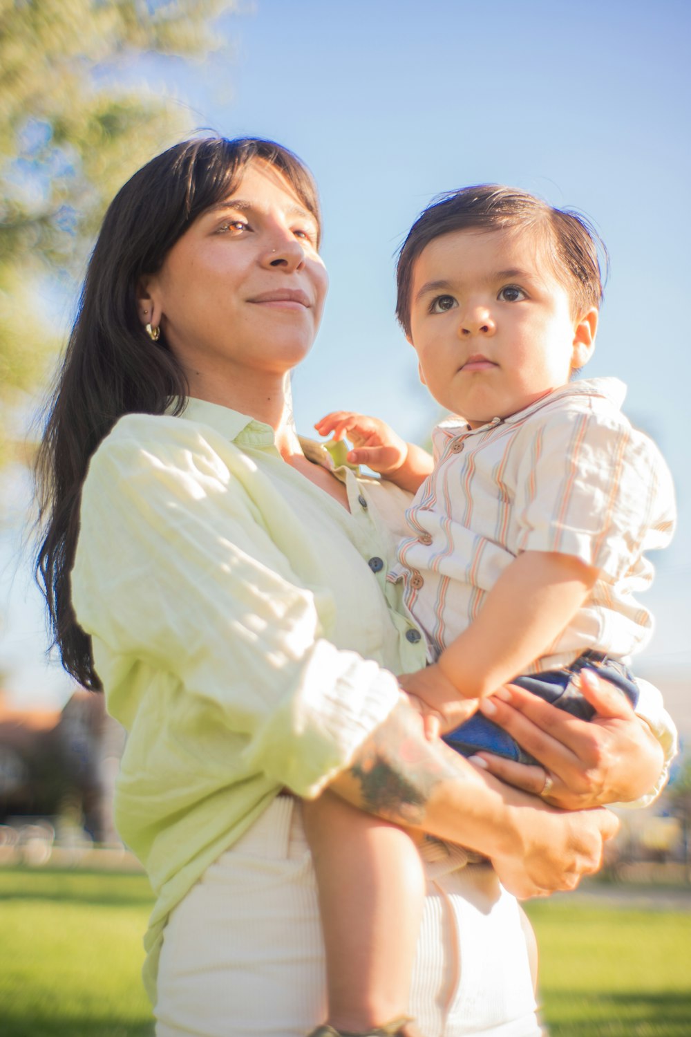 a woman holding a small child in her arms