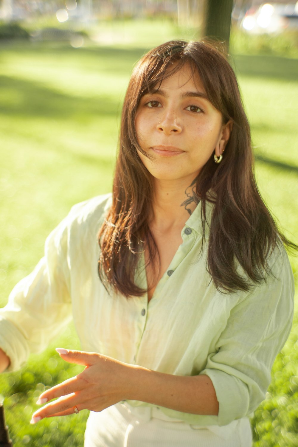 a woman holding a wine glass in her hand