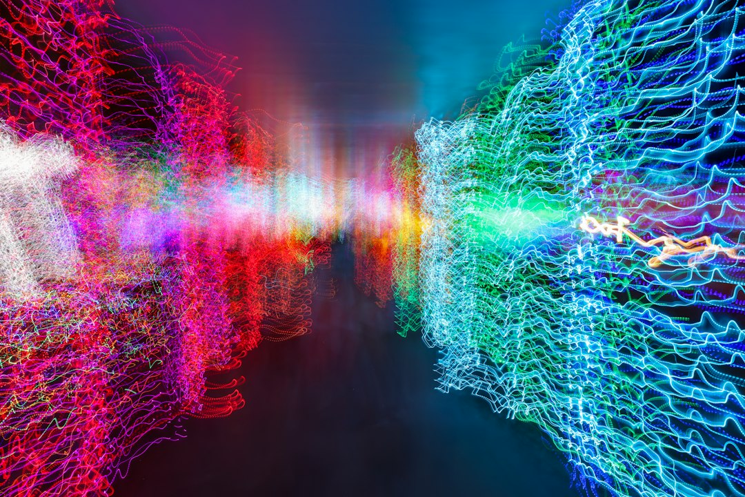 an abstract image of colorful lights in a dark room