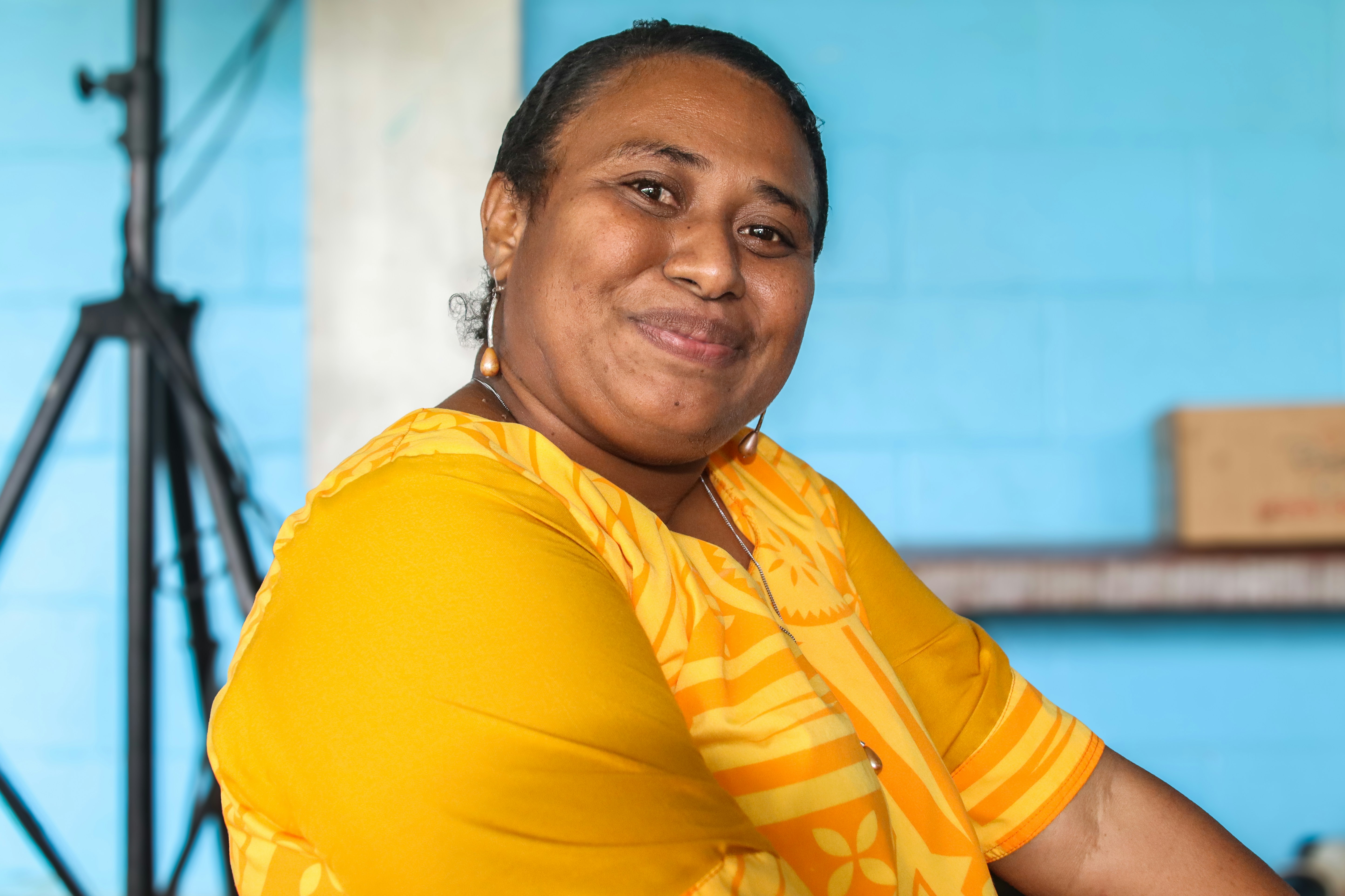 Amara Osei woman in yellow top smiling
