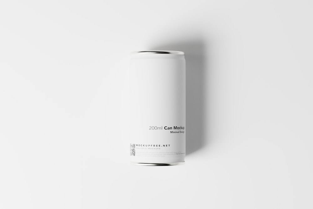 a can of coffee sitting on top of a white surface