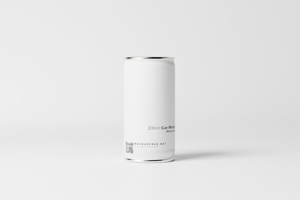 A plain white aluminum can is placed against a minimalistic, light gray background. The can has a sleek and smooth surface with text indicating a capacity of 200ml, and includes a small QR code and website information near the bottom.