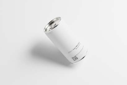 A white cylindrical can with a metallic top and bottom is placed on a light background. The can features minimal text and a QR code near the bottom. The text reads 