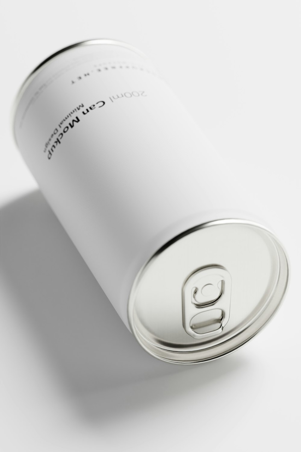 a can of soda sitting on top of a white table