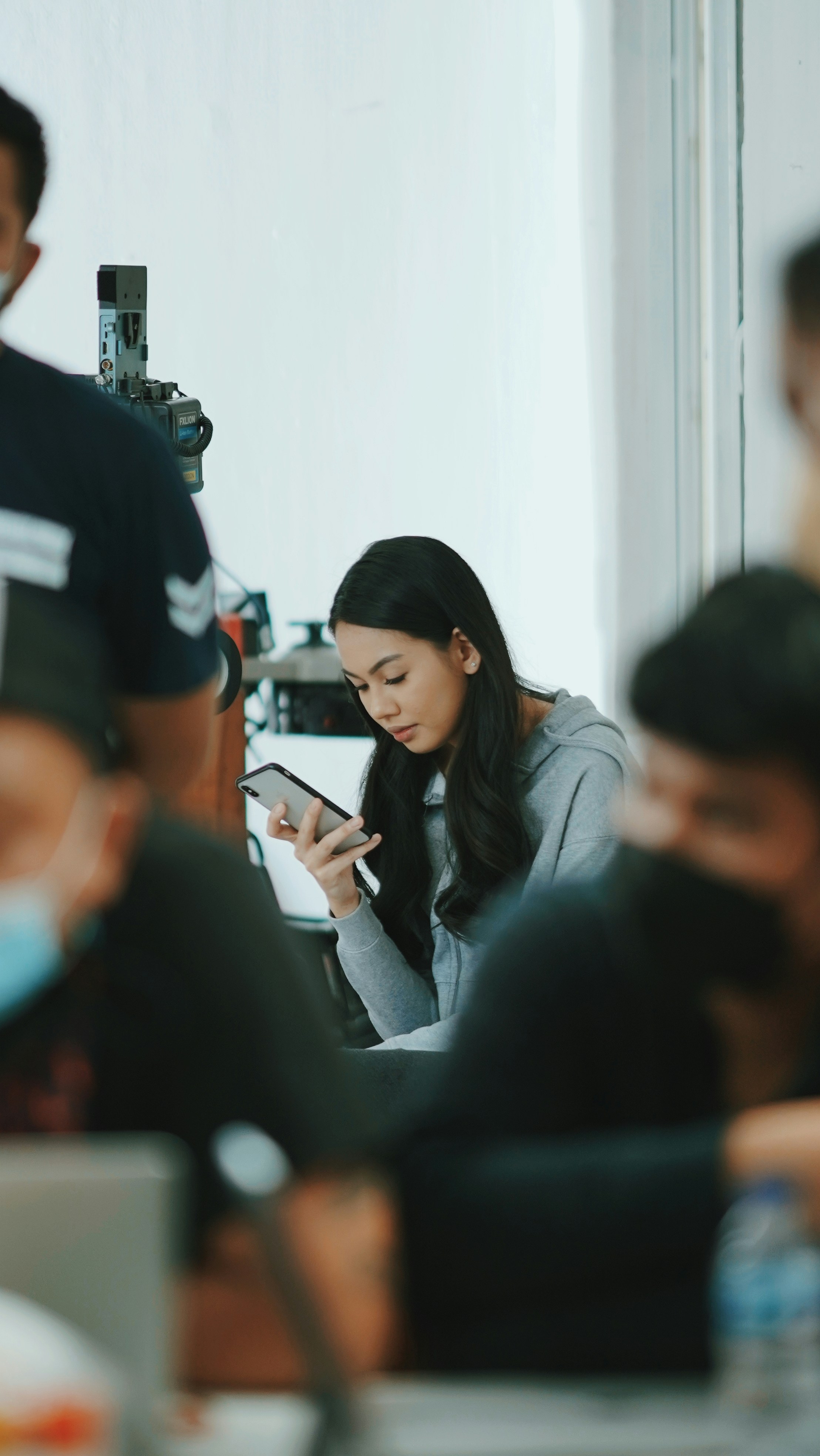A diverse group of people using devices to access a website