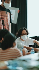 Team meeting discussing workplace safety protocols.