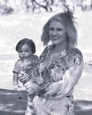 Isabella Grace smiling warmly during a heartfelt sermon, dressed in neutral tones that reflect her elegant style.