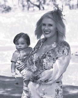 Model wearing a comfortable and elegant baby doll, smiling softly.