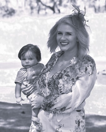 Isabella Grace smiling warmly during a heartfelt sermon, dressed in neutral tones that reflect her elegant style.