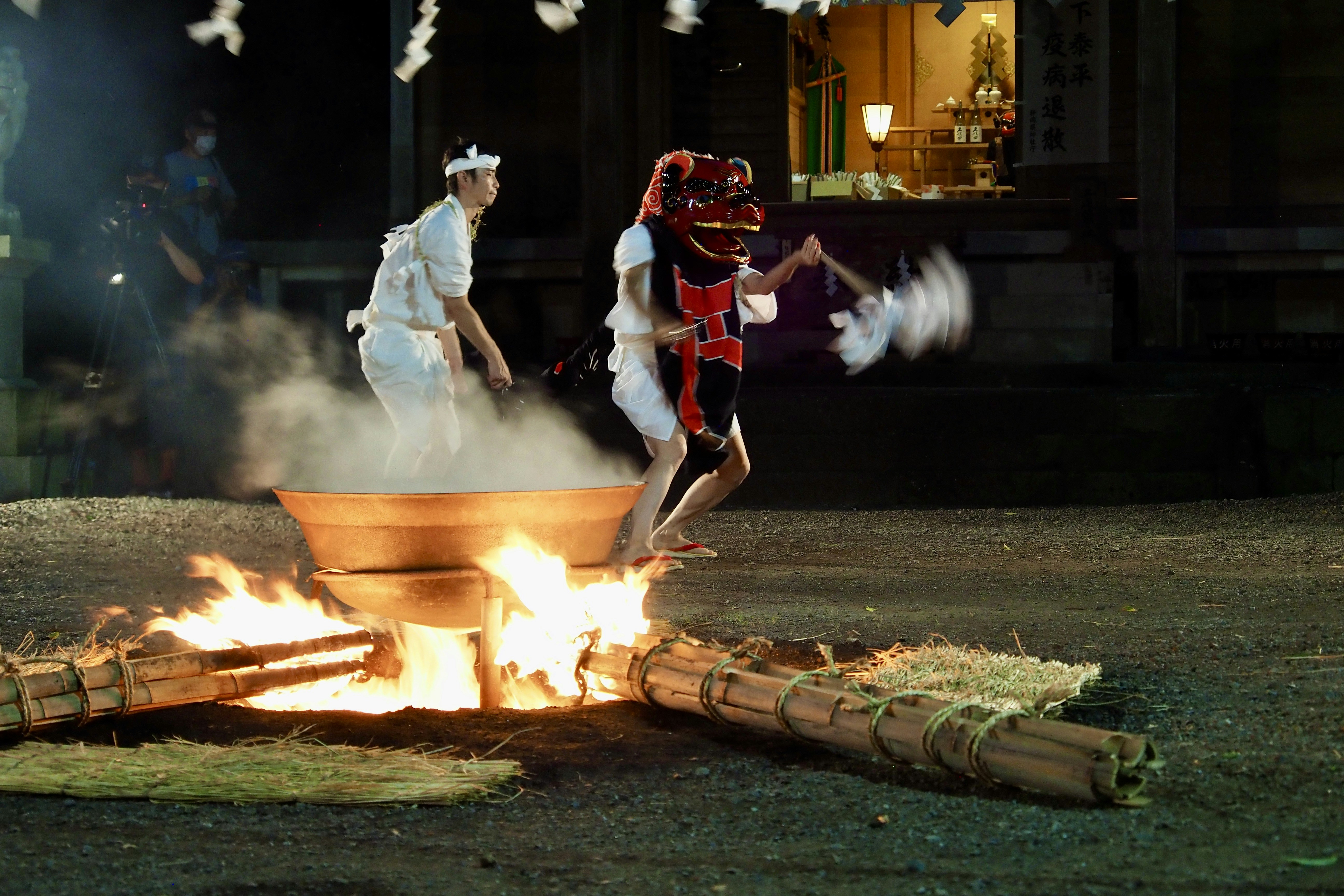 Miko performing traditional shrine ceremonies with sacred implements