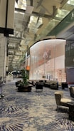 A corporate event space featuring modern decor and seating.