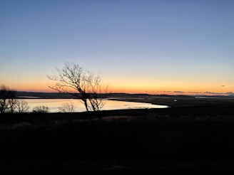 A serene landscape at sunset, symbolizing reflection and peace.