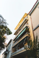 Front view of the Adityaraj residential complex with balconies and greenery.