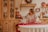 A smiling woman holding a beautifully decorated holiday table.