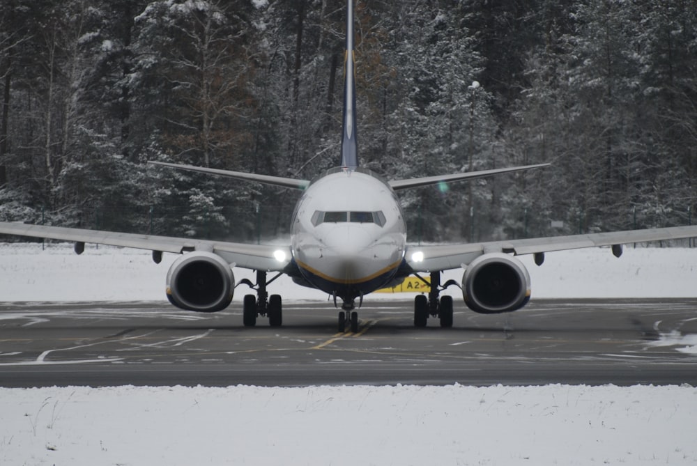 a large jetliner sitting on top of an airport runway