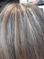 Before and after photos showing gray hair transformed into deep chestnut brown.