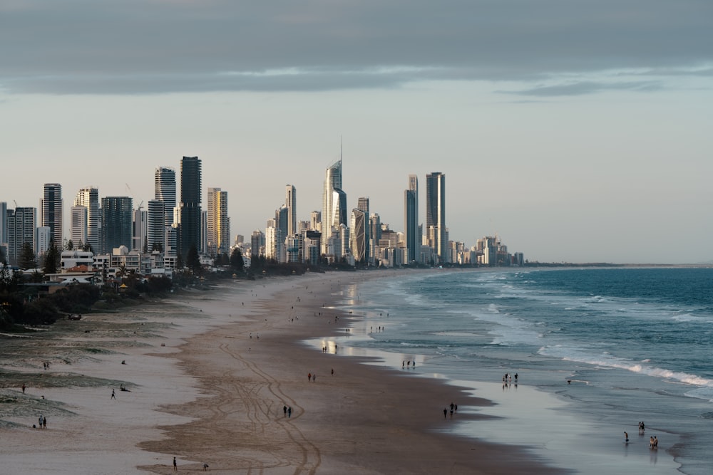 a view of a beach with a city in the background