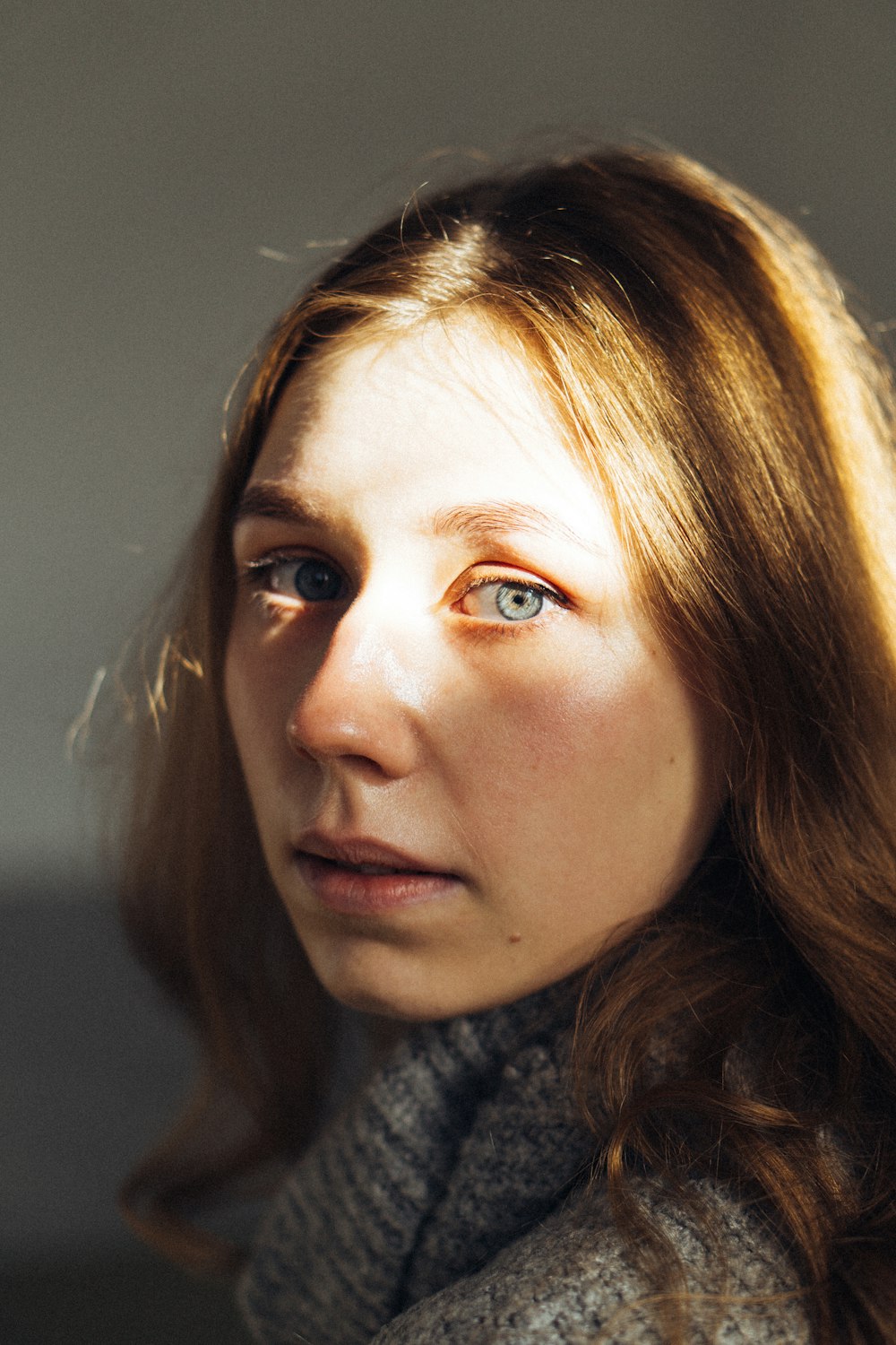 a close up of a person wearing a scarf