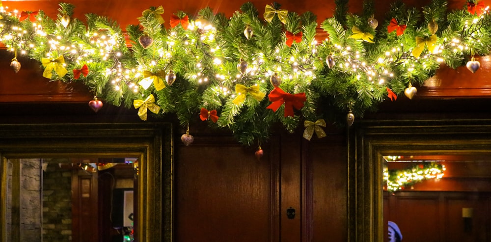a doorway decorated with christmas garland and lights