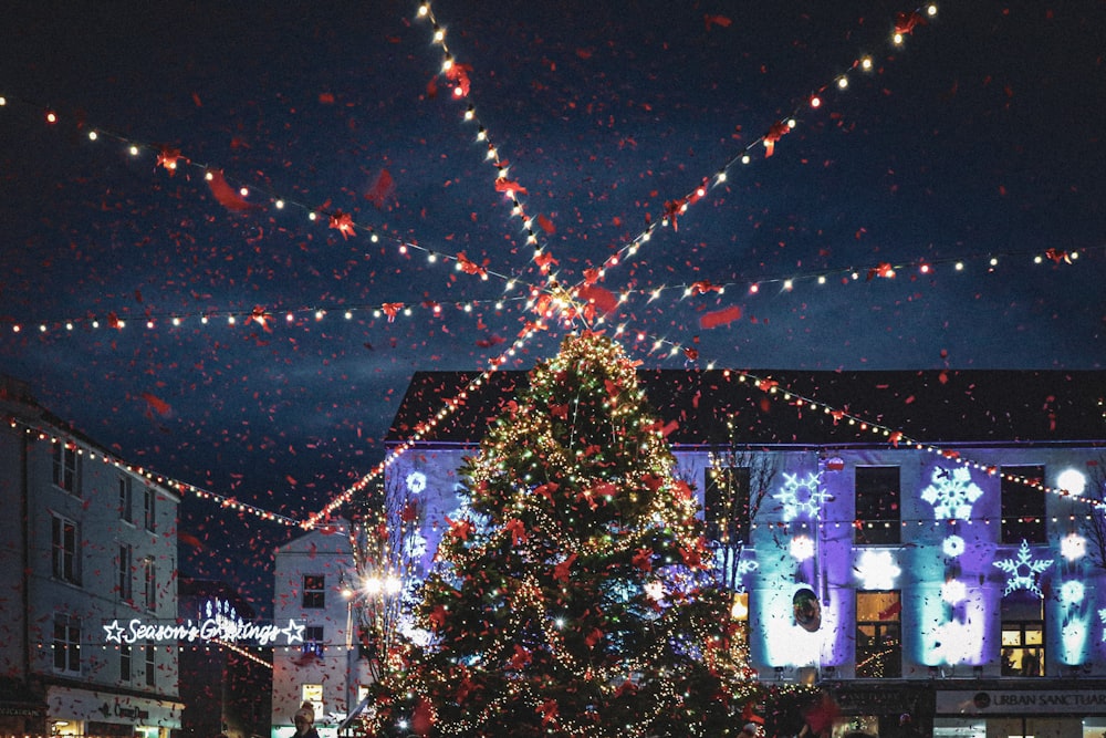 a large christmas tree in a city square