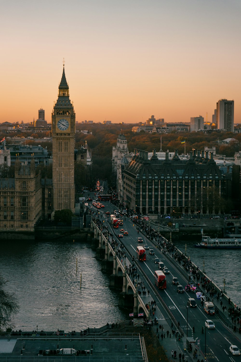 a view of a city with a bridge and a clock tower