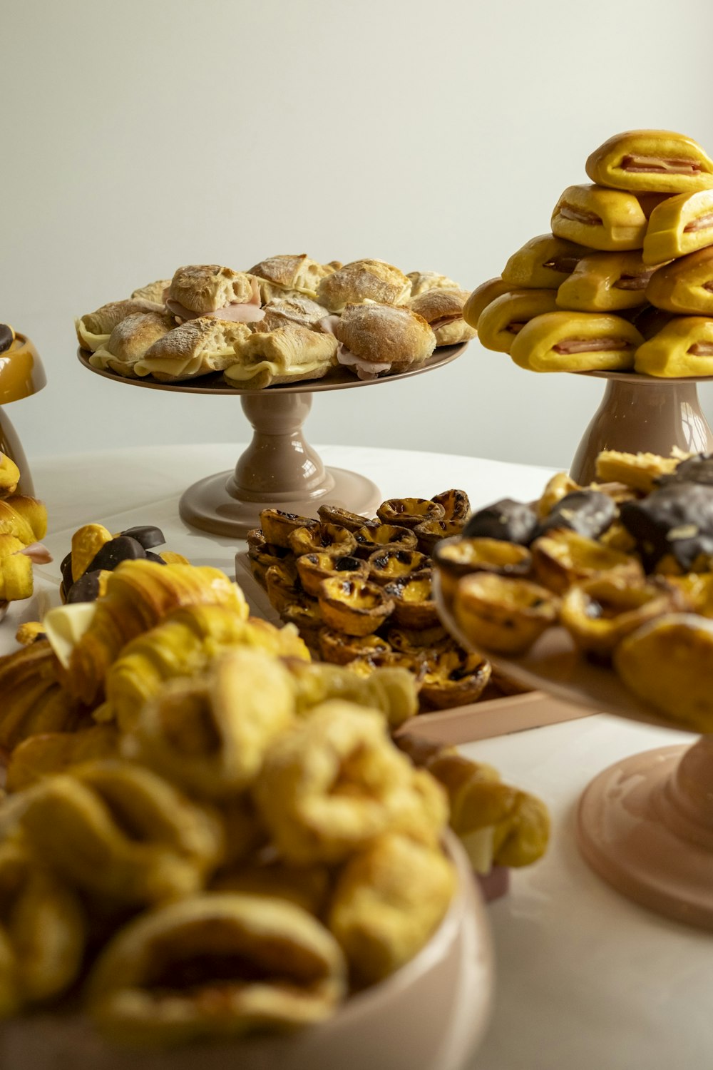 a table topped with lots of different types of pastries