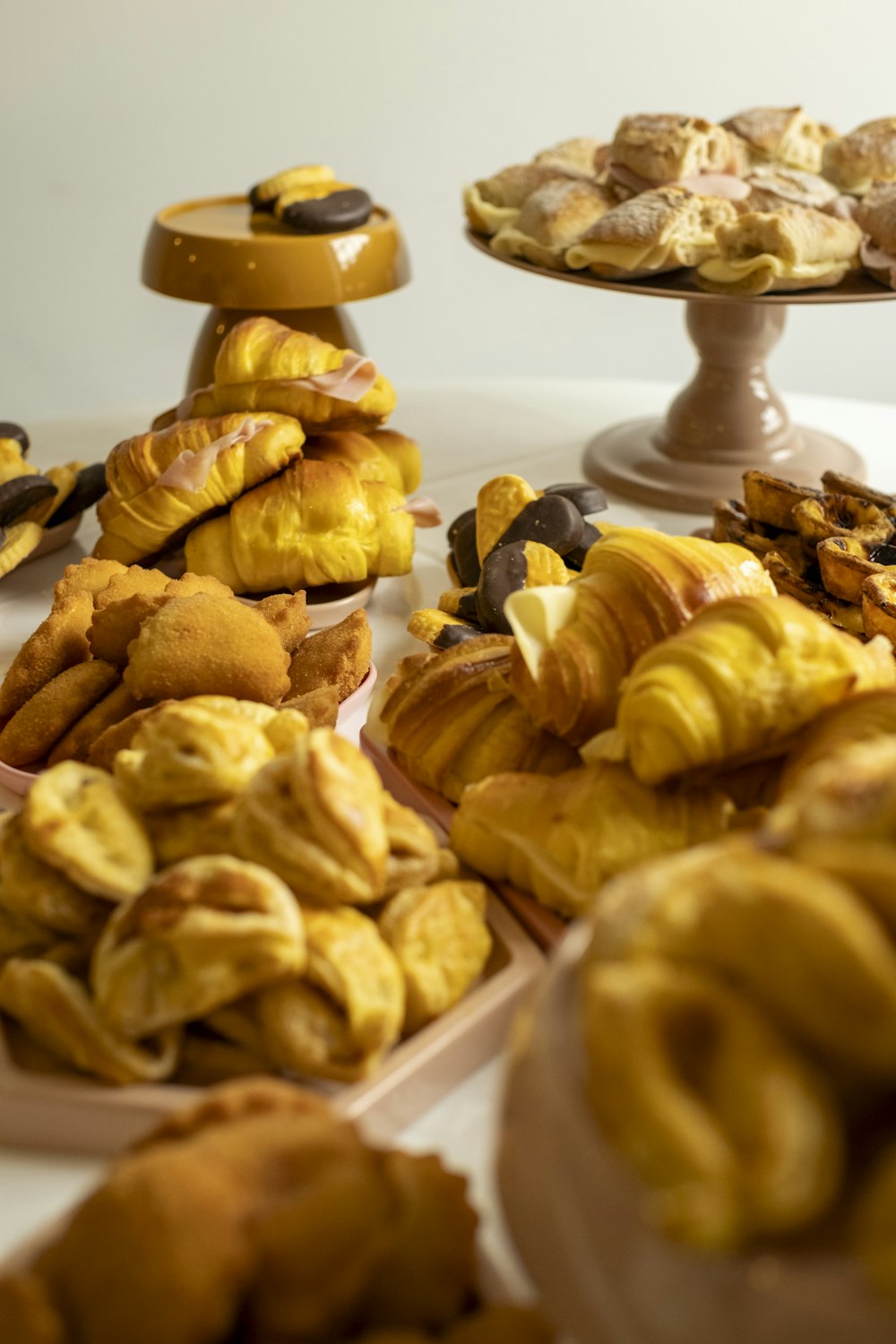 a table topped with lots of different types of pastries