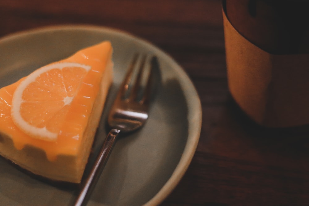 a piece of cheesecake on a plate with a fork