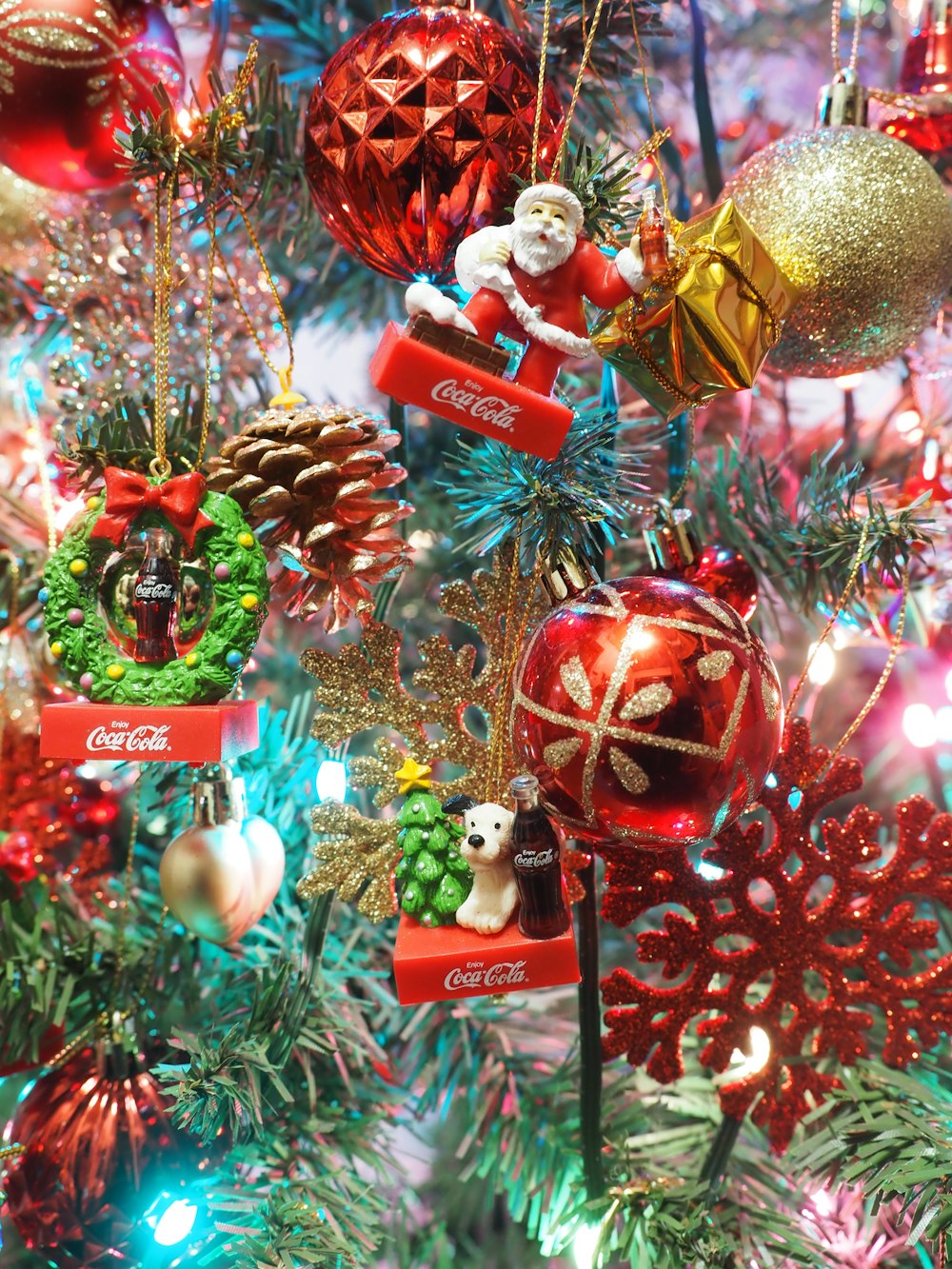 a close up of a christmas tree with ornaments