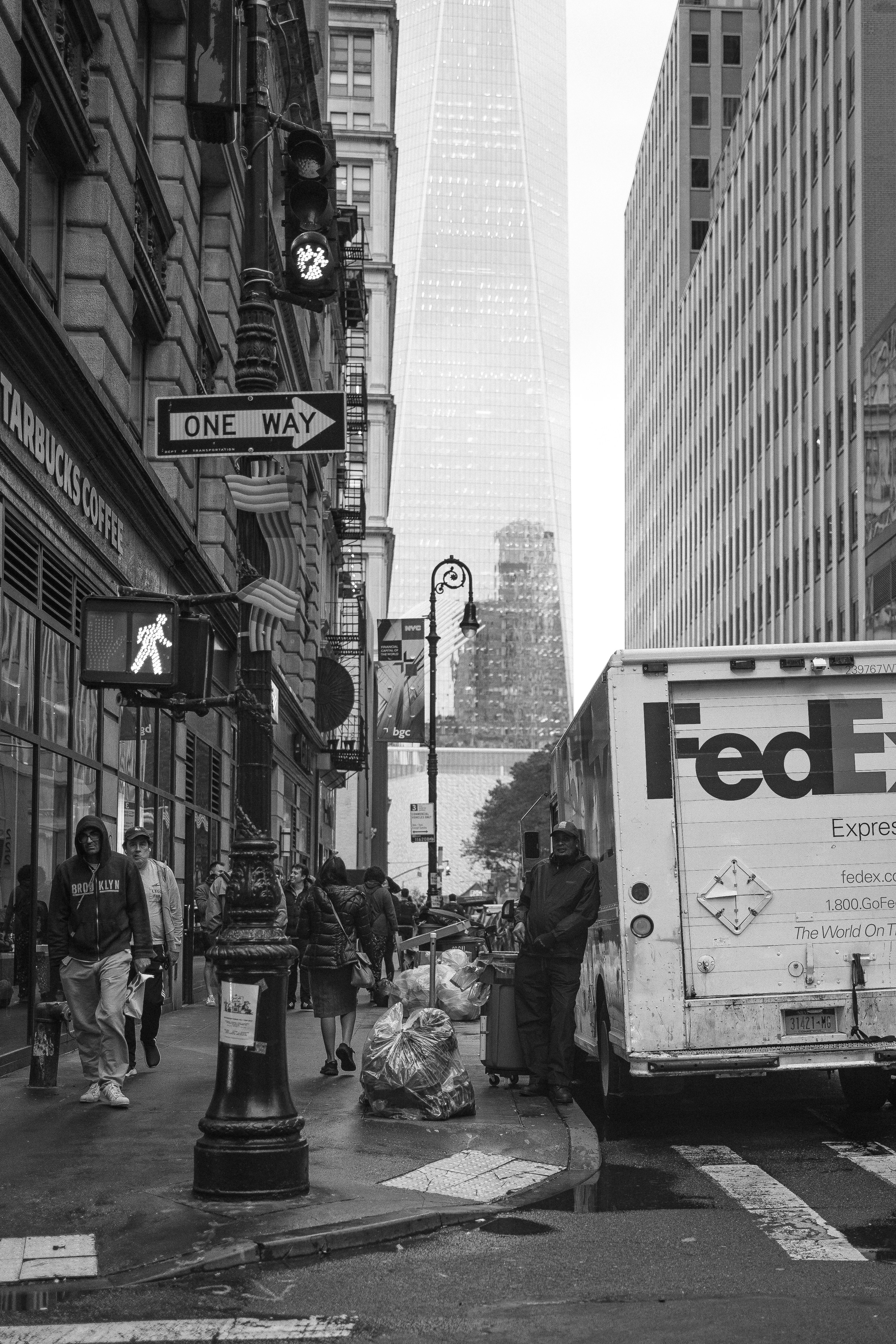 a fedex truck parked on the side of the road