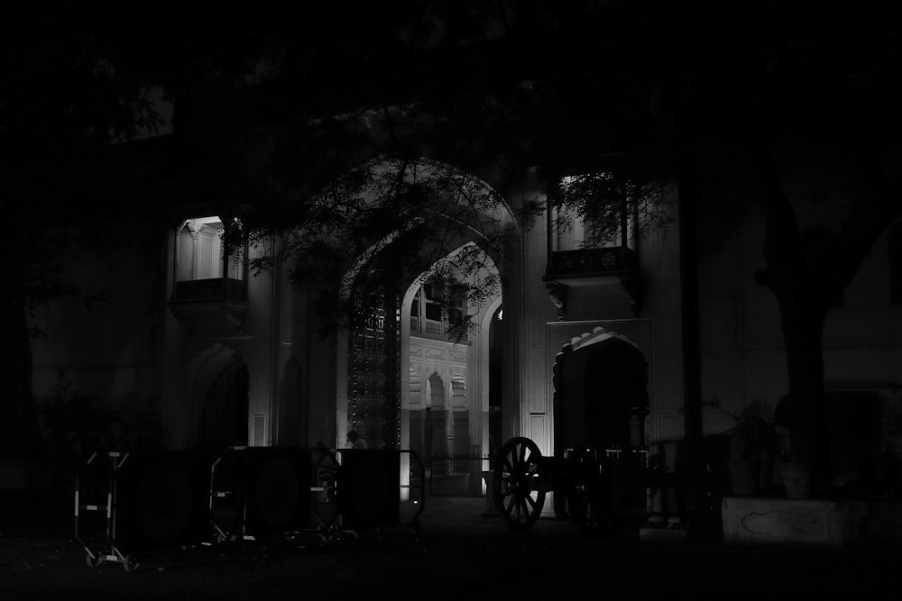 a black and white photo of a building at night